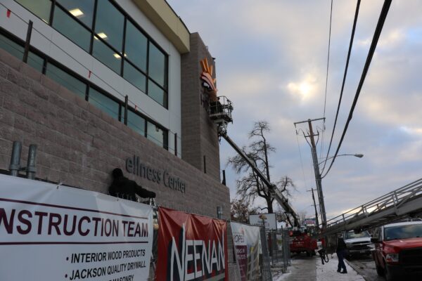 Yesco installs the signage for the front of the building including the name and the HOPES logo.