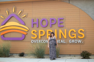 Diana standing in front of the Hop Springs Building