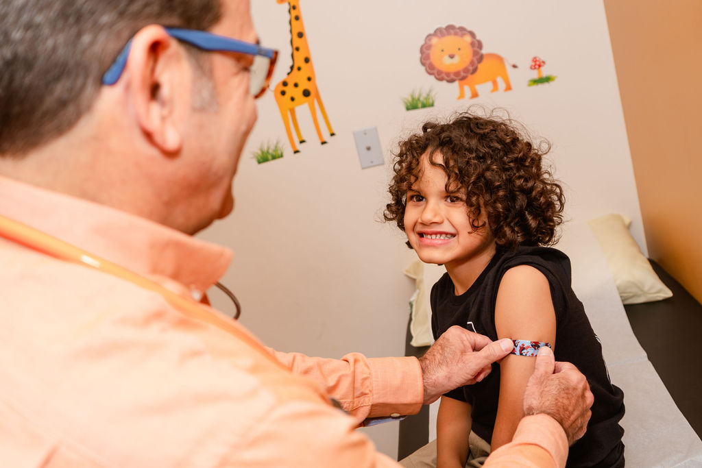 young patient getting bandaid