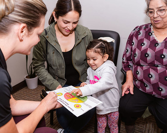 family with young daughter at appointment