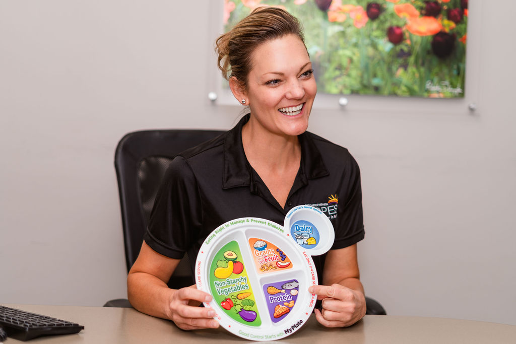 Nutritionist showing a divided plate