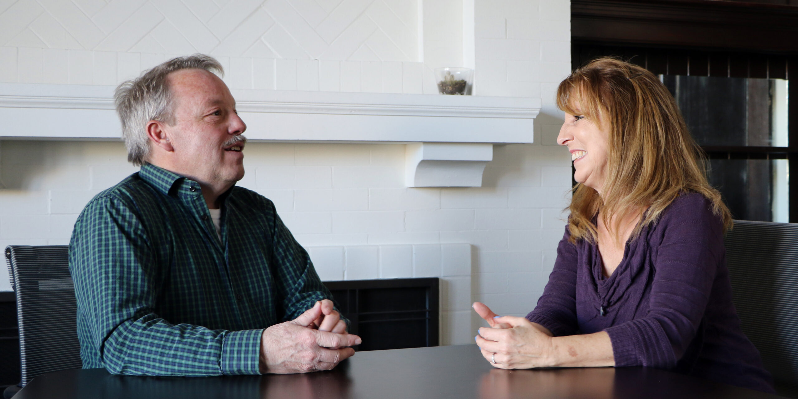 Alex talking to one of his case managers, Wilma W., who helped him get back on his feet.